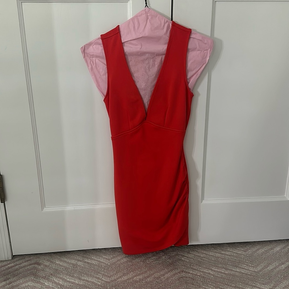 Sexy deep cut orange Superdown mini dress from Revolve.